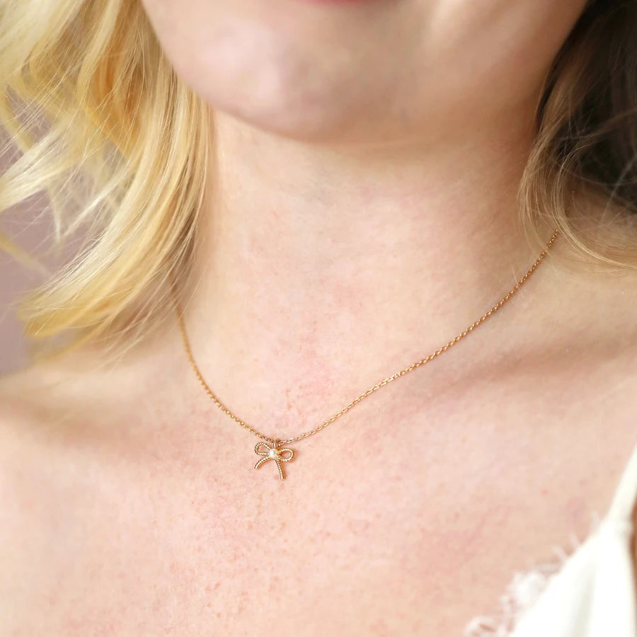 Lisa Angel Tiny Pearl Bow Pendant Necklace in Gold