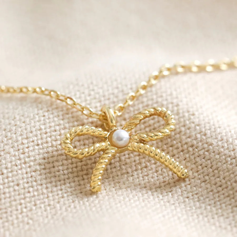 Lisa Angel Tiny Pearl Bow Pendant Necklace in Gold
